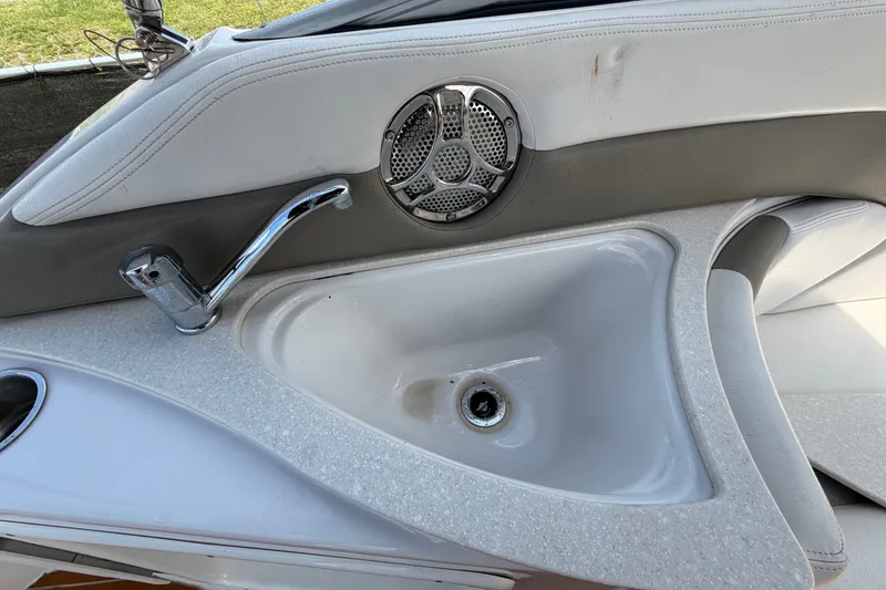 Slide: The Image of Interior sink and faucet on a 2016 Glastron GS 259 boat. - 21