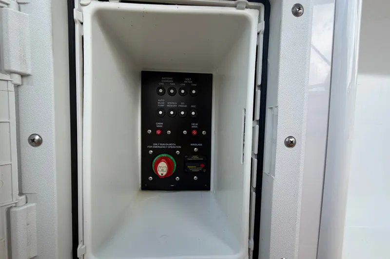 Slide: The Image of Electrical control panel inside 2016 Glastron GS 259 boat compartment. - 18