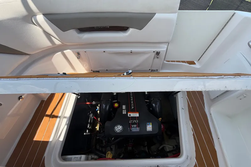 Slide: The Image of 2016 Glastron GS 259 boat engine compartment with Volvo Penta 270 V8 engine. - 83