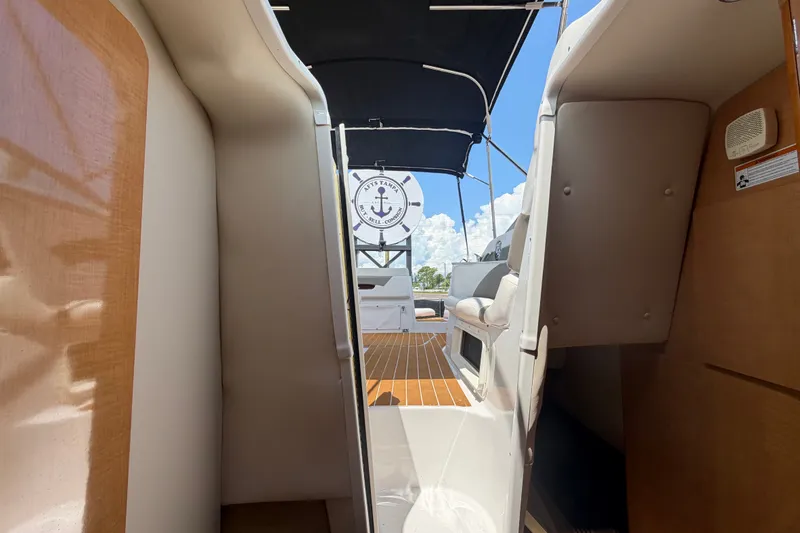 Slide: The Image of Interior view of 2016 Glastron GS 259 boat with seating and canopy. - 70