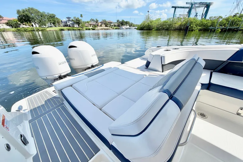 Slide: The Image of 2021 Chaparral 280 OSX boat with Yamaha engines on a calm waterway. - 11