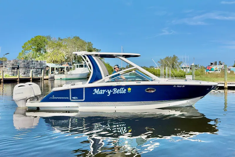 Slide: The Image of 2021 Chaparral 280 OSX boat named "Mary-Belle" on calm water, sunny day. - 3