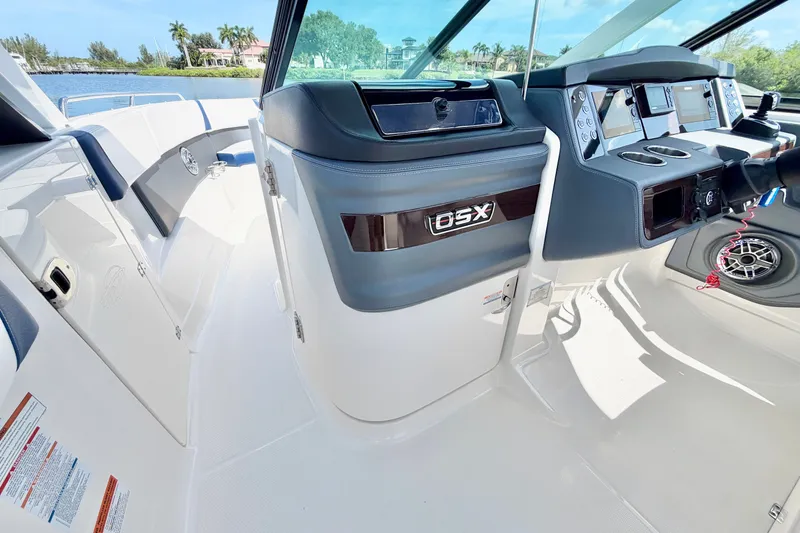 Slide: The Image of 2021 Chaparral 280 OSX boat interior with modern dashboard and controls. - 22