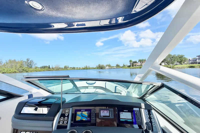 Slide: The Image of Cockpit view of 2021 Chaparral 280 OSX boat on a sunny day. - 21