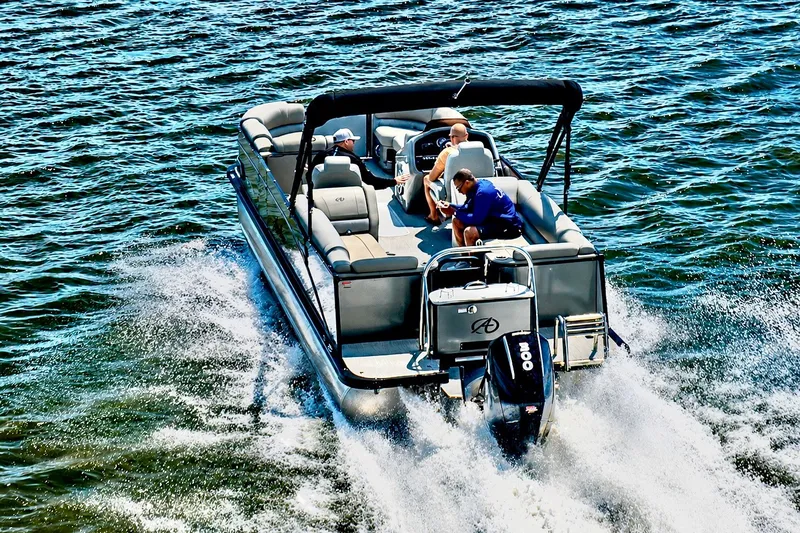 Slide: The Image of 2022 Avalon Catalina Platinum Quad Lounge boat cruising on water. - 3