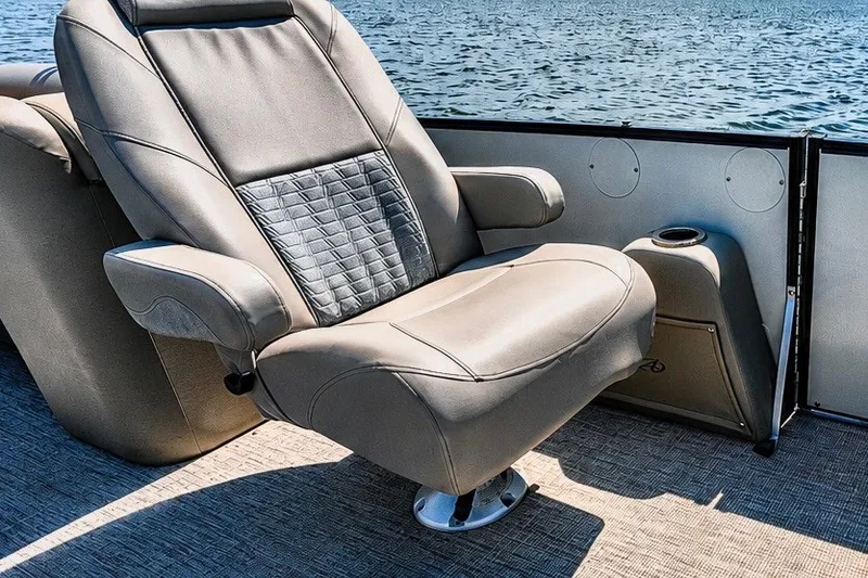 Slide: The Image of Luxurious seating on 2022 Avalon Catalina Platinum Quad Lounge boat, overlooking serene water. - 7