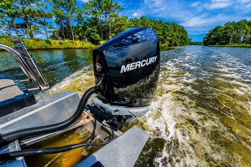 Slide: The Image of 2022 Avalon Catalina Platinum boat with Mercury engine cruising on a scenic river. - 12