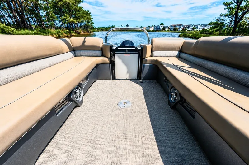 Slide: The Image of 2022 Avalon Catalina Platinum Quad Lounge boat interior with spacious seating and scenic water view. - 9