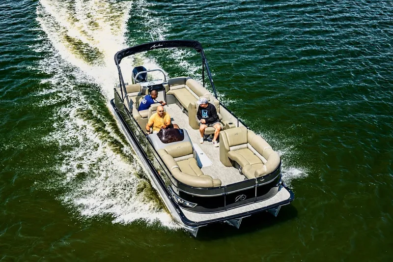 Slide: The Image of 2022 Avalon Catalina Platinum Quad Lounge 25' pontoon boat cruising on a sunny day. - 5