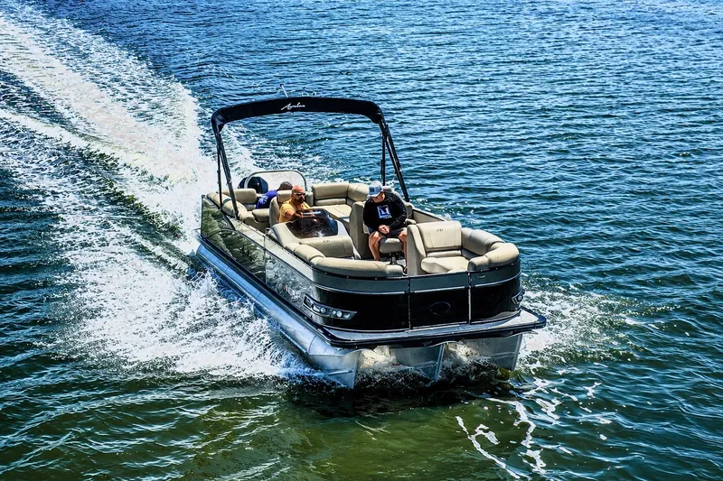 Slide: The Image of 2022 Avalon Catalina Platinum Quad Lounge 25' cruising on a sunny lake. - 1