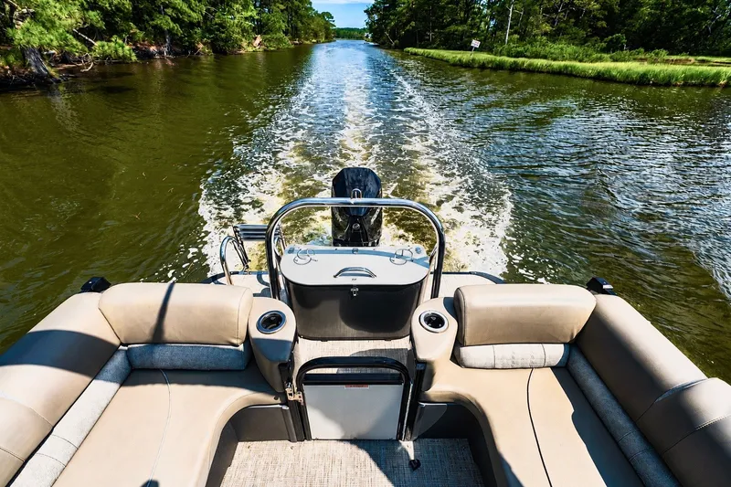 Slide: The Image of 2022 Avalon Catalina Platinum Quad Lounge cruising on a scenic river. - 4