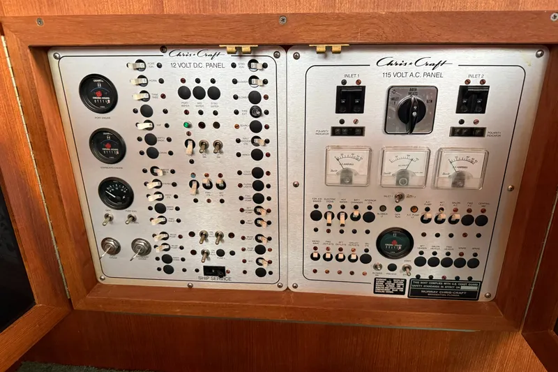 Slide: The Image of 1987 Chris-Craft 362 Catalina electrical panel with 12V DC and 115V AC controls. - 21