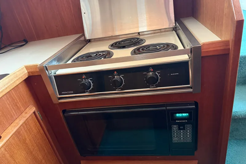 Slide: The Image of Electric stove and microwave in 1987 Chris-Craft 362 Catalina yacht kitchen. - 16