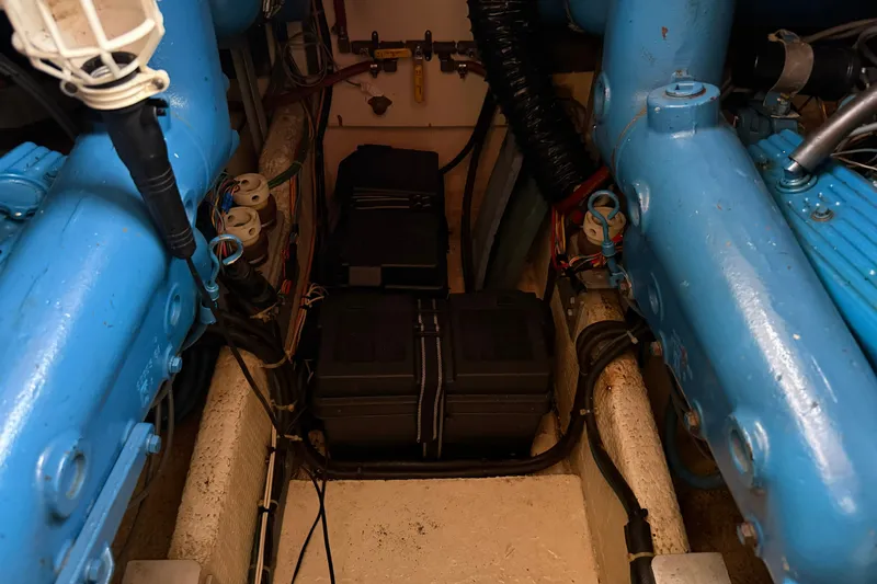Slide: The Image of Engine compartment of 1987 Chris-Craft 362 Catalina with blue engine components and wiring. - 37