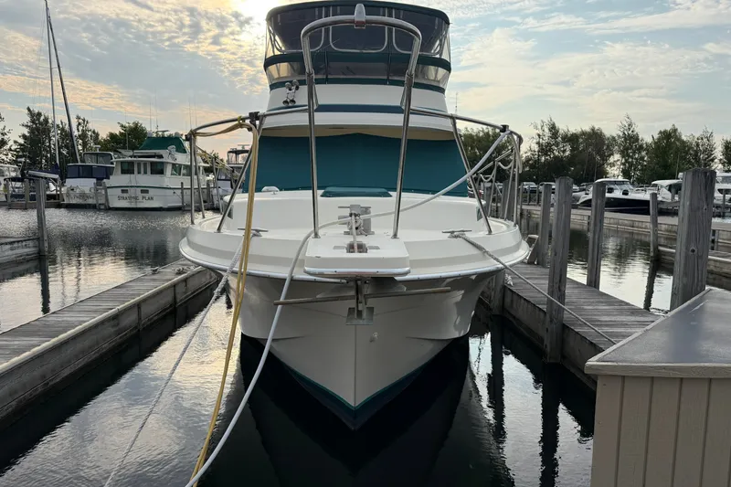 Slide: The Image of 1987 Chris-Craft 362 Catalina docked at marina, front view with clear sky. - 3