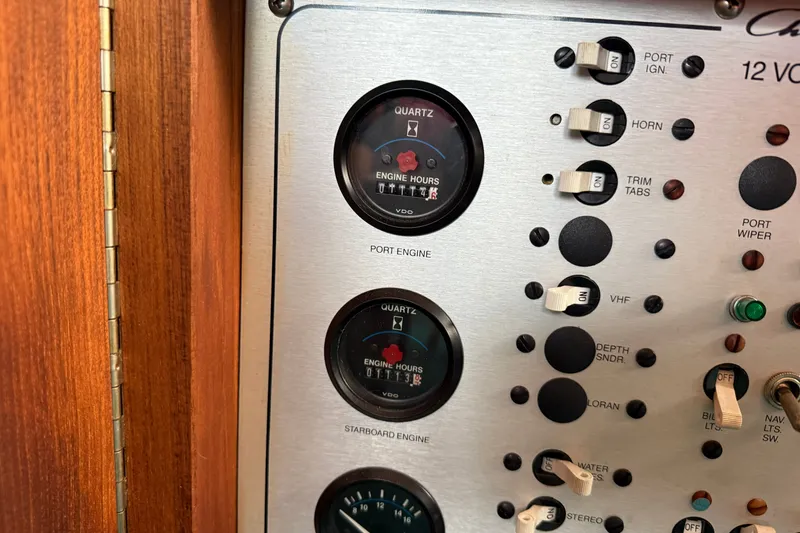 Slide: The Image of Control panel of a 1987 Chris-Craft 362 Catalina boat with engine hour meters and switches. - 22