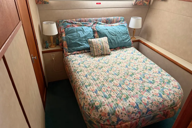 Slide: The Image of Cozy bedroom in 1987 Chris-Craft 362 Catalina yacht with floral bedding and bedside lamps. - 26