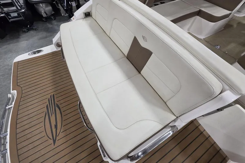 Slide: The Image of 2014 Chaparral 307 SSX boat with white seating and teak-style deck. - 9