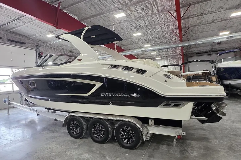 Slide: The Image of 2014 Chaparral 307 SSX boat on trailer in indoor storage facility. - 5