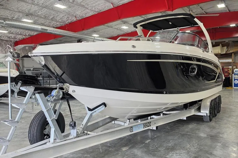 Slide: The Image of 2014 Chaparral 307 SSX boat on trailer in indoor showroom. - 7