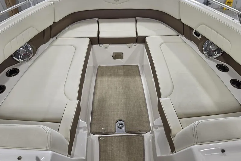 Slide: The Image of Interior seating of 2014 Chaparral 307 SSX boat, featuring beige and brown upholstery. - 17