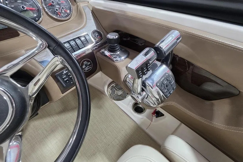 Slide: The Image of Interior cockpit of 2014 Chaparral 307 SSX boat with steering wheel and controls. - 15