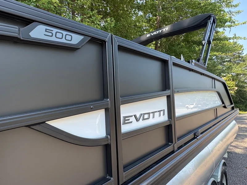 Slide: The Image of Close-up of an Evotti 521QL boat with a sleek design and clean lines. - 9