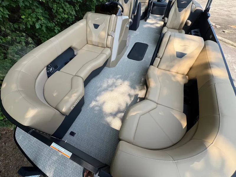 Slide: The Image of The image shows the interior of a 2027 Evotti 521QL with beige leather seating. - 14
