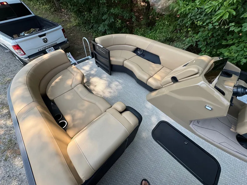 Slide: The Image of The image shows the interior of a 2027 Evotti 521QL boat with beige leather seating. - 25