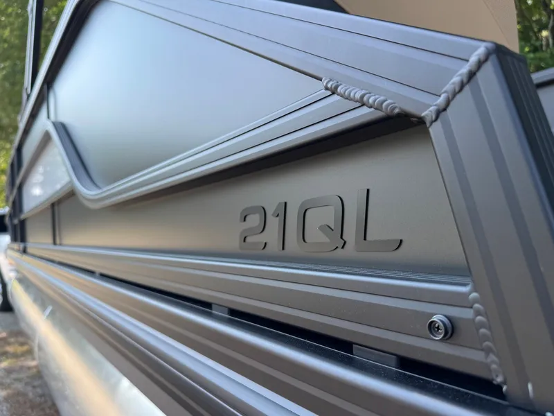 Slide: The Image of Close-up of the side paneling on an Evotti 521QL boat with a sleek design. - 12