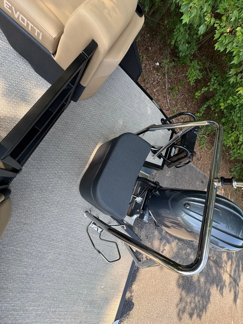 Slide: The Image of The image shows the deck of an Evotti 521QL boat with a seat and motor. - 20