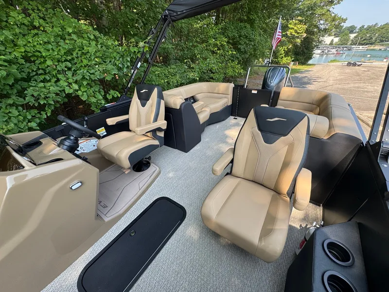 Slide: The Image of The image shows the interior of a 2027 Evotti 521QL boat with beige leather seating. - 24