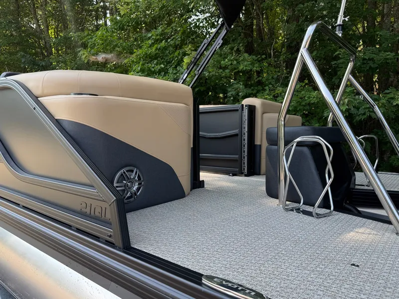 Slide: The Image of The image shows the interior of a 2027 Evotti 521QL boat with beige seating and stainless steel railings. - 11