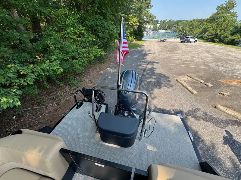 Slide: The Image of A 2027 Evotti 521QL boat with an outboard motor and an American flag at the stern. - 22