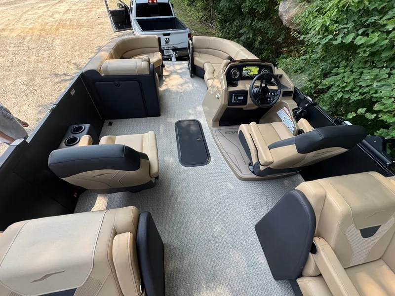 Slide: The Image of The image shows the interior of a 2027 Evotti 521QL boat with luxurious seating and a modern helm. - 21