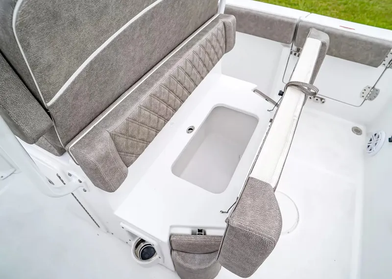 Slide: The Image of The 2027 Sea Hunt Ultra 245 SE features a cushioned bench seat with storage underneath. - 12