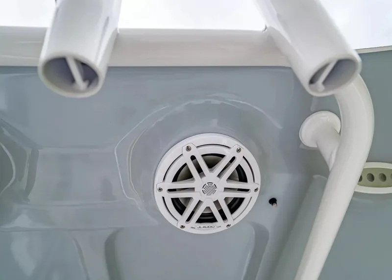 Slide: The Image of Close-up of a speaker and fishing rod holders on a boat. - 15
