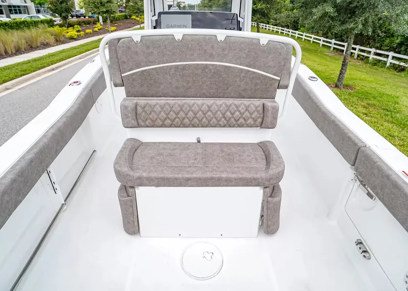 Slide: The Image of The image shows the seating area of a 2027 Sea Hunt Ultra 245 SE boat with gray upholstery. - 13