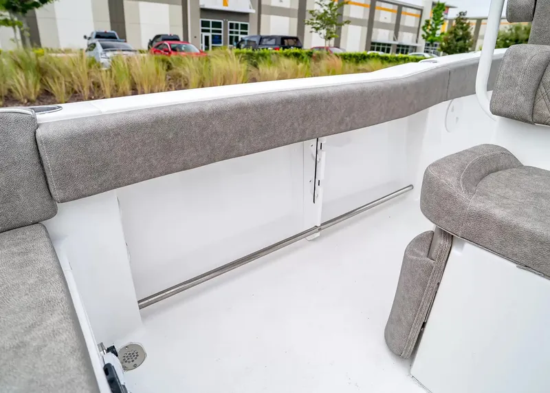 Slide: The Image of The image shows the interior of a Sea Hunt Ultra 245 SE boat with gray upholstery. - 9