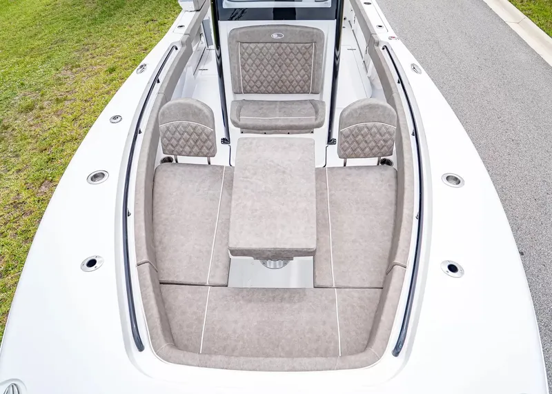 Slide: The Image of The image shows the cockpit of a 2026 Sea Hunt Gamefish 25 with cushioned seating. - 23