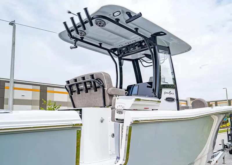 Slide: The Image of The image shows a 2026 Sea Hunt Gamefish 25 boat with a modern helm and fishing rod holders. - 6