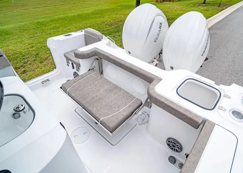 Slide: The Image of The image shows the stern of a Sea Hunt Gamefish 25 boat with two Yamaha engines. - 7