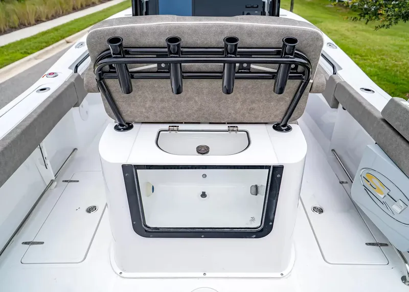 Slide: The Image of The image shows the cockpit of a Sea Hunt Gamefish 25 boat with rod holders and a livewell. - 12