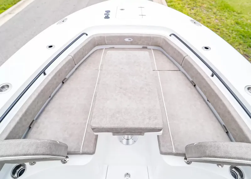 Slide: The Image of The image shows the bow of a Sea Hunt Gamefish 25 boat with cushioned seating. - 22