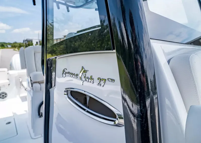 Slide: The Image of Close-up of the Sea Hunt Gamefish 27 with shiny lettering and polished details. - 22