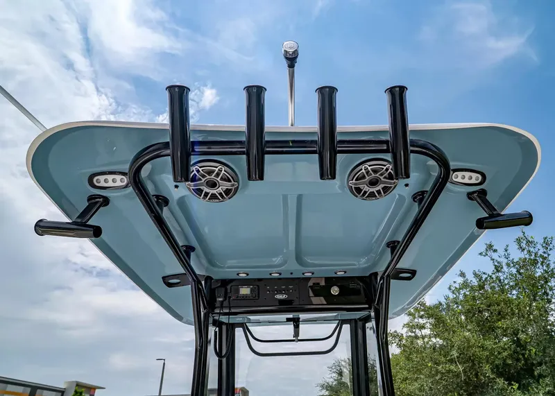Slide: The Image of The image shows the T-top of a Sea Hunt Gamefish 27 Coffin Box with speakers and rod holders. - 14