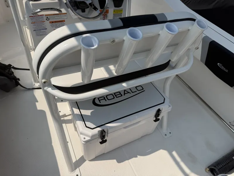 Slide: The Image of The image shows a Robalo R200 Center Console with a white cooler and four rod holders. - 10