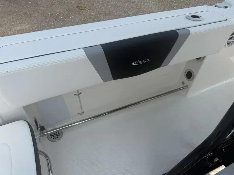 Slide: The Image of The 2027 Robalo R200 Center Console features a clean, white bench seat with stainless steel details. - 11