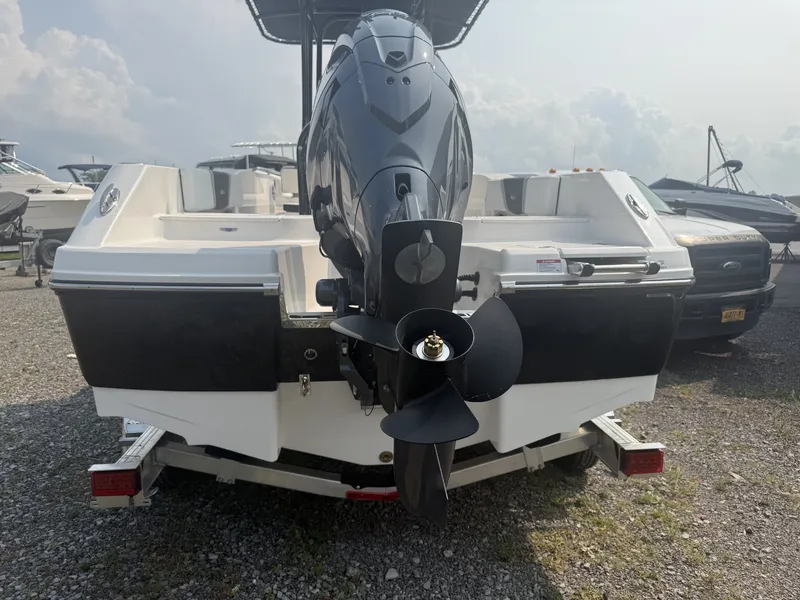 Slide: The Image of The image shows the rear of a Robalo R200 Center Console boat with an outboard motor. - 14
