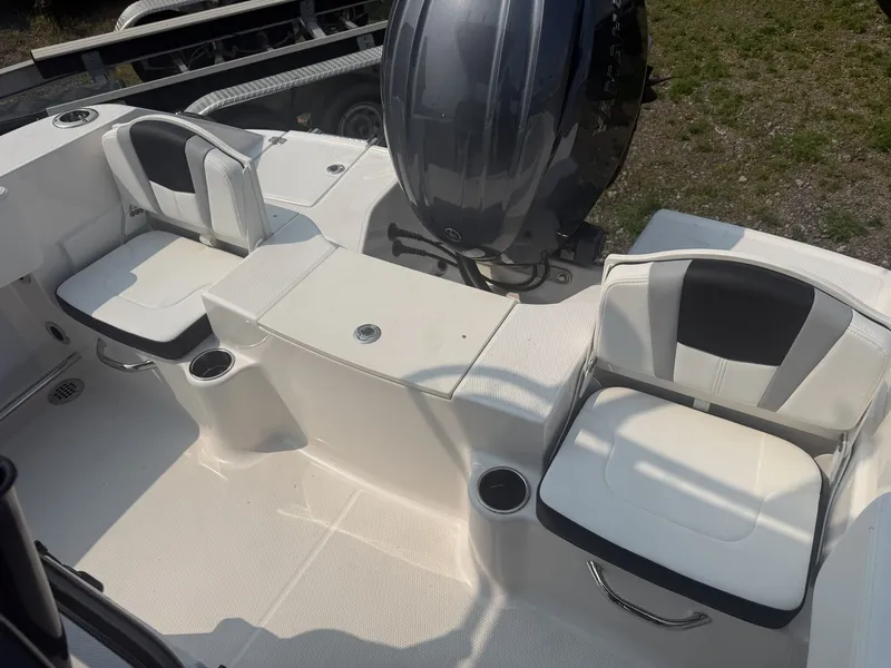 Slide: The Image of The image shows the seating area of a Robalo R200 Center Console boat with two cushioned seats. - 9